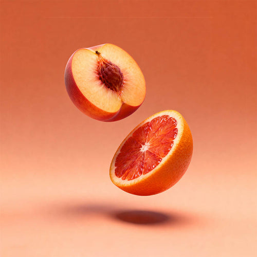 A floating peach half and a floating blood orange half suspended against a warm peach-orange gradient background.