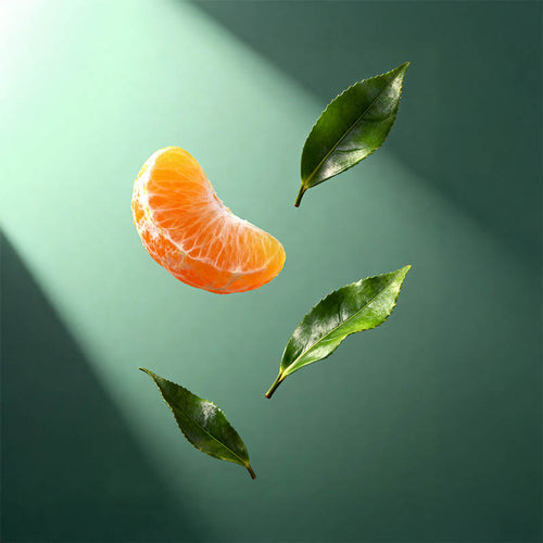 A floating orange segment next to three green leaves against a dark green background with diagonal light rays.